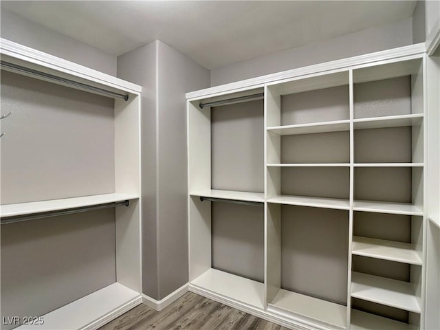 9604 Vital Crest St, Las Vegas, NV 89123 - spacious closet featuring wood finished floors