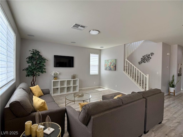 9604 Vital Crest St, Las Vegas, NV 89123 - living room featuring stairway and light wood finished floors