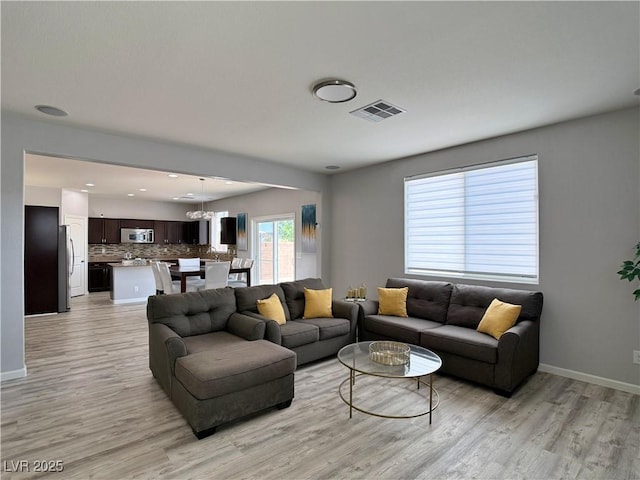9604 Vital Crest St, Las Vegas, NV 89123 - living room with light wood-style flooring and recessed lighting