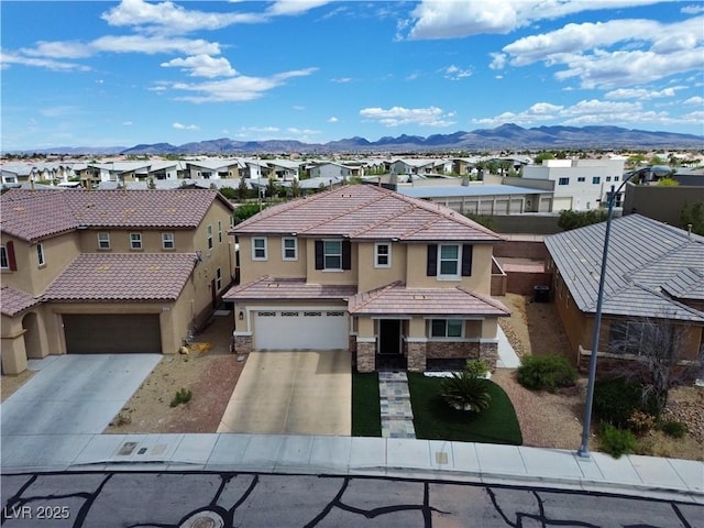 9604 Vital Crest St, Las Vegas, NV 89123 - view of front of house with a residential view, stucco siding, stone siding, and a mountain view