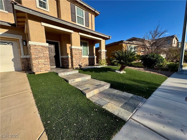9604 Vital Crest St, Las Vegas, NV 89123 - view of front of home featuring stucco siding, stone siding, covered porch, and a front yard
