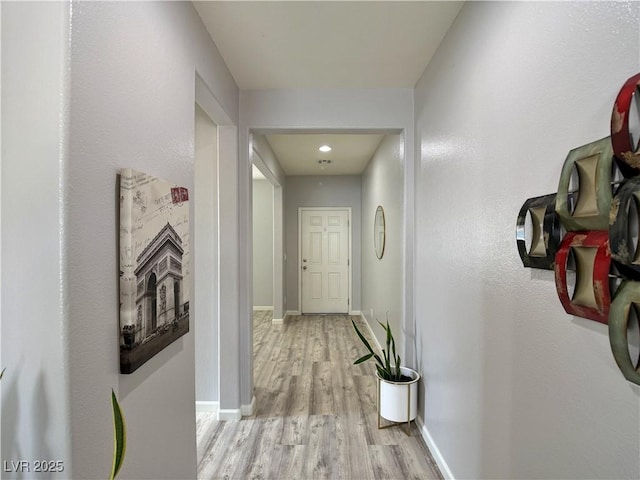 9604 Vital Crest St, Las Vegas, NV 89123 - hall with light wood-style flooring and baseboards