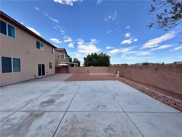 9604 Vital Crest St, Las Vegas, NV 89123 - fenced backyard with a patio