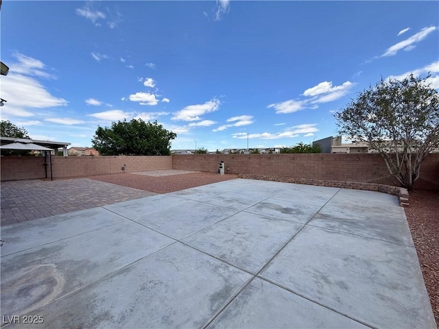 9604 Vital Crest St, Las Vegas, NV 89123 - fenced backyard with a patio area
