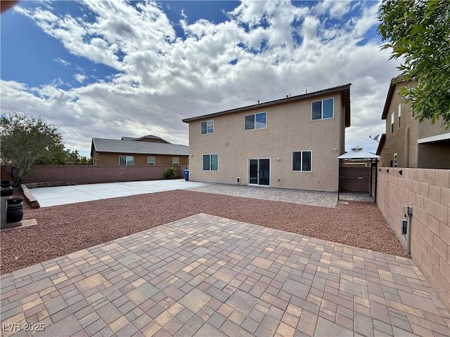 9604 Vital Crest St, Las Vegas, NV 89123 - rear view of property with a patio area, a fenced backyard, stucco siding, and a gazebo
