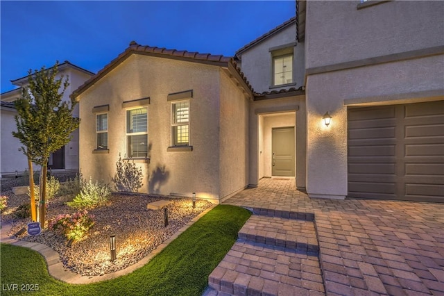 8984 Rolling Pietra St, Las Vegas, NV 89166 - view of front facade with stucco siding, a garage, and a tile roof