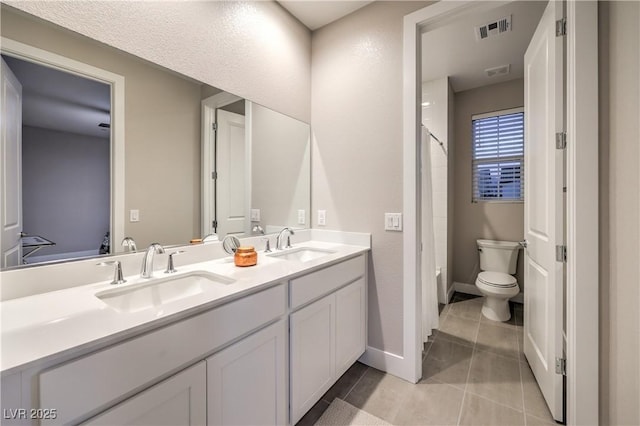 8984 Rolling Pietra St, Las Vegas, NV 89166 - full bath with double vanity, tile patterned floors, and shower / bath combination with curtain