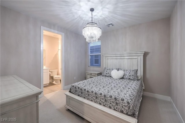 8984 Rolling Pietra St, Las Vegas, NV 89166 - bedroom with light colored carpet, a chandelier, and ensuite bathroom