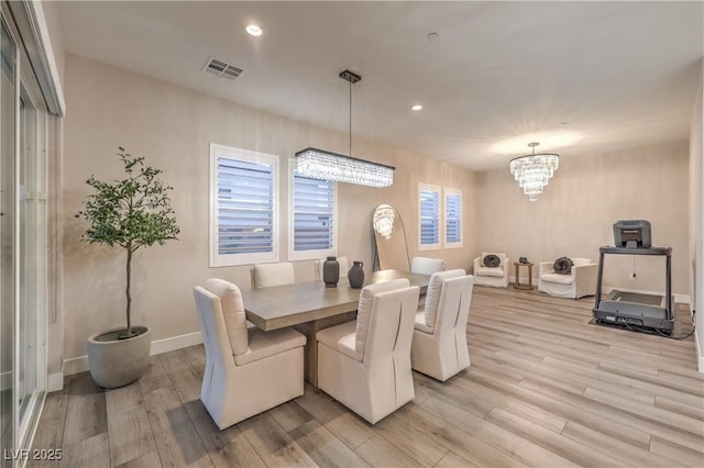 8984 Rolling Pietra St, Las Vegas, NV 89166 - dining area with a chandelier, light wood-style floors, and recessed lighting