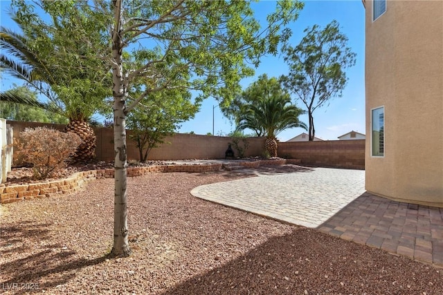 9004 Harbor Wind Ave, Las Vegas, NV 89178 - fenced backyard with a patio area