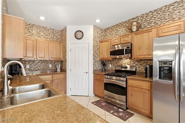 9004 Harbor Wind Ave, Las Vegas, NV 89178 - kitchen with stainless steel appliances, light tile patterned flooring, tasteful backsplash, light brown cabinetry, and recessed lighting