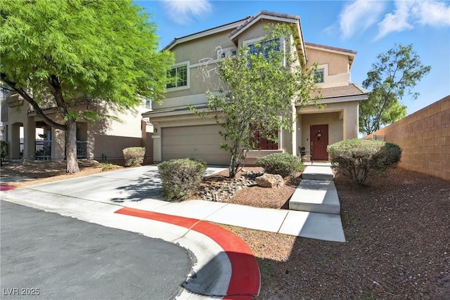 9004 Harbor Wind Ave, Las Vegas, NV 89178 - obstructed view of property with stucco siding, concrete driveway, and an attached garage