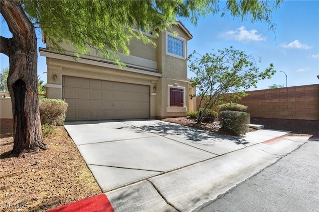 9004 Harbor Wind Ave, Las Vegas, NV 89178 - view of front facade with stucco siding, driveway, and a garage