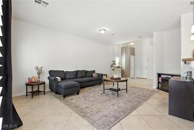 9004 Harbor Wind Ave, Las Vegas, NV 89178 - living area with light tile patterned floors and a chandelier