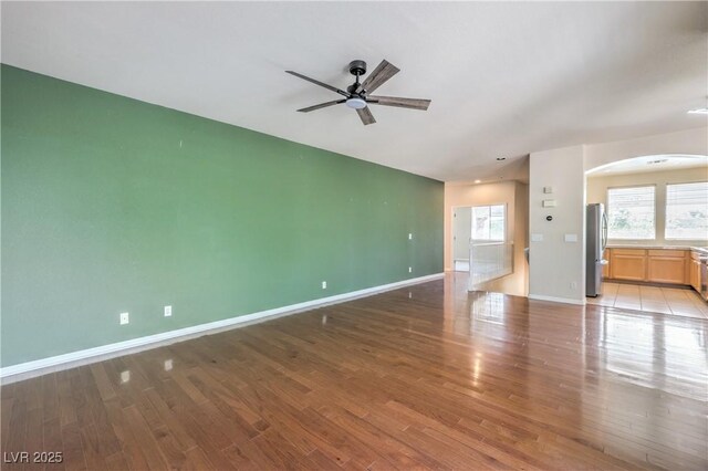 801 Dana Hills Ct Unit 101, Las Vegas, NV 89134 - unfurnished room featuring arched walkways, ceiling fan, and light wood-style floors