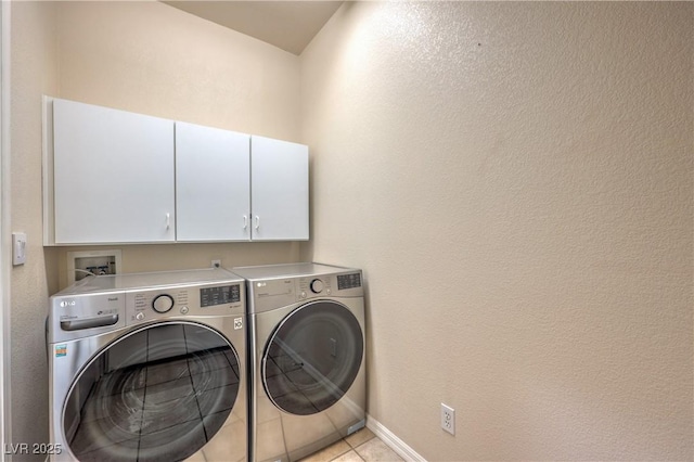 801 Dana Hills Ct Unit 101, Las Vegas, NV 89134 - washroom featuring separate washer and dryer, cabinet space, and light tile patterned floors