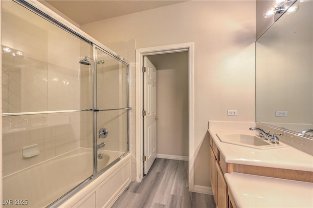 801 Dana Hills Ct Unit 101, Las Vegas, NV 89134 - bathroom featuring vanity, shower / bath combination with glass door, and wood finished floors