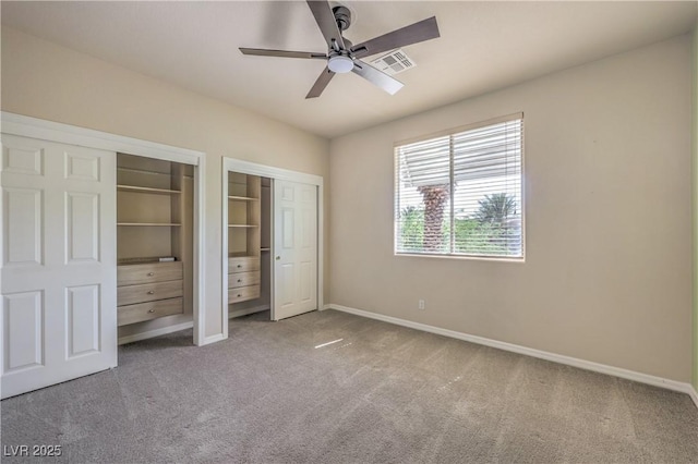 801 Dana Hills Ct Unit 101, Las Vegas, NV 89134 - unfurnished bedroom with two closets, carpet, and a ceiling fan
