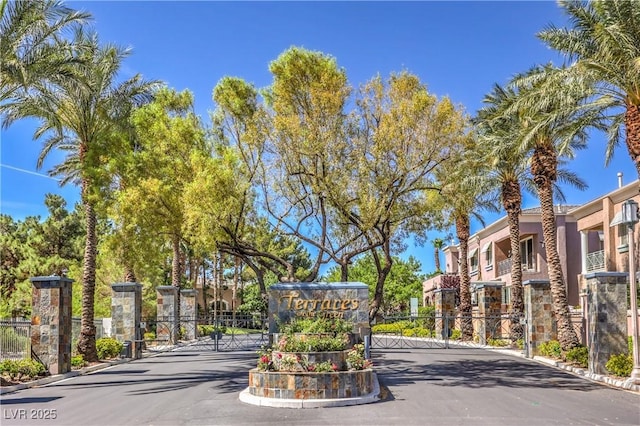 801 Dana Hills Ct Unit 101, Las Vegas, NV 89134 - view of asphalt street with a gate, a gated entry, curbs, and a residential view
