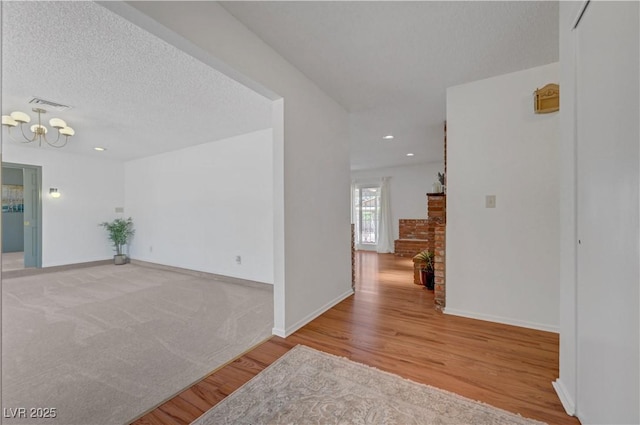 1705 Westwind Rd, Las Vegas, NV 89146 - corridor featuring a chandelier, wood finished floors, and recessed lighting