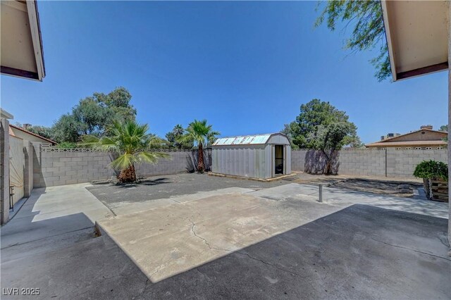 1705 Westwind Rd, Las Vegas, NV 89146 - fenced backyard with a storage shed and a patio