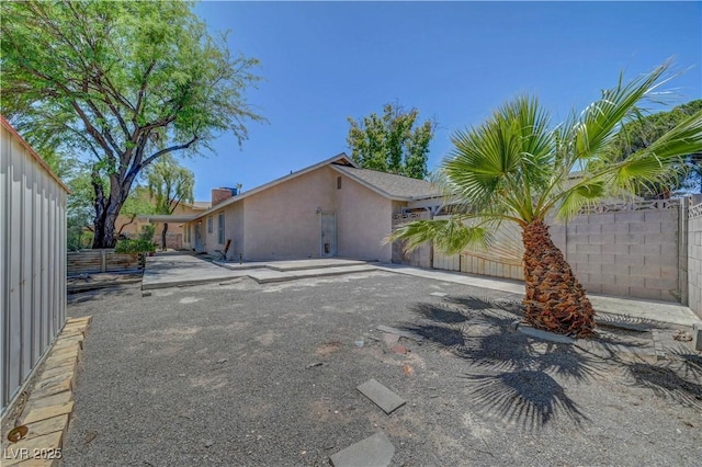1705 Westwind Rd, Las Vegas, NV 89146 - view of home's exterior with stucco siding and a patio