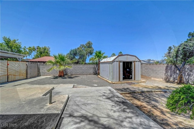 1705 Westwind Rd, Las Vegas, NV 89146 - fenced backyard featuring a storage unit and a patio area