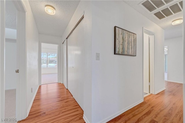 1705 Westwind Rd, Las Vegas, NV 89146 - hall featuring light wood finished floors and a textured ceiling
