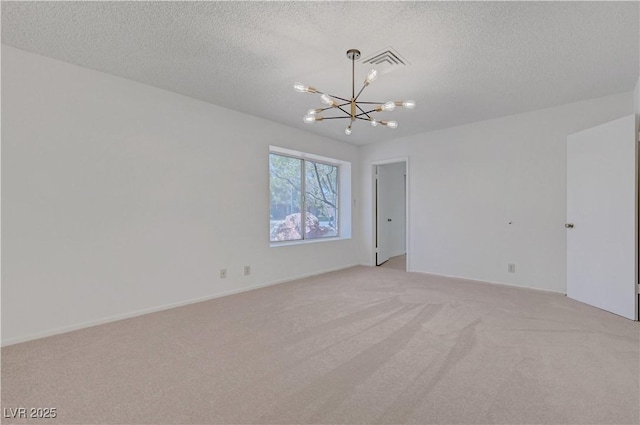 1705 Westwind Rd, Las Vegas, NV 89146 - spare room with a chandelier, light carpet, and a textured ceiling