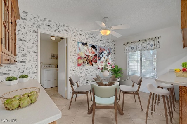 1705 Westwind Rd, Las Vegas, NV 89146 - dining space with washer / dryer, wallpapered walls, a textured ceiling, ceiling fan, and light tile patterned flooring