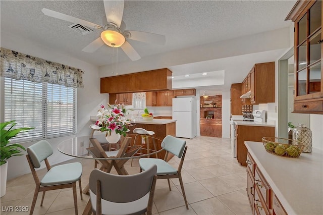 1705 Westwind Rd, Las Vegas, NV 89146 - dining room with a textured ceiling, ceiling fan, and light tile patterned floors