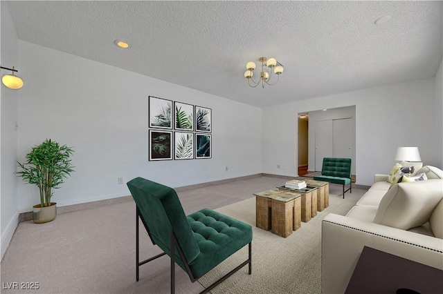 1705 Westwind Rd, Las Vegas, NV 89146 - living room featuring light carpet, a chandelier, and a textured ceiling