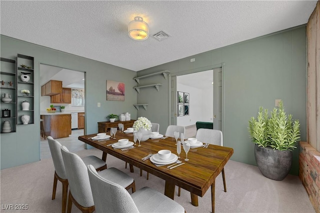 1705 Westwind Rd, Las Vegas, NV 89146 - dining room featuring light colored carpet and a textured ceiling