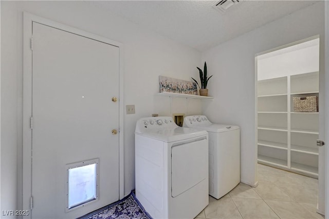 1705 Westwind Rd, Las Vegas, NV 89146 - washroom with independent washer and dryer and light tile patterned floors