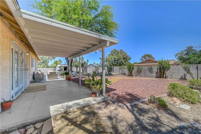 1705 Westwind Rd, Las Vegas, NV 89146 - fenced backyard with a patio area