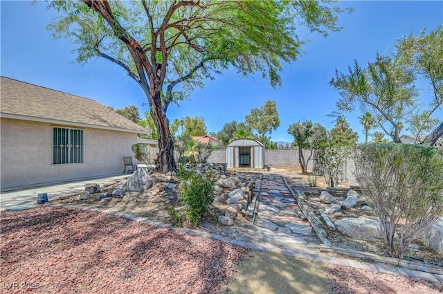 1705 Westwind Rd, Las Vegas, NV 89146 - fenced backyard with a storage unit