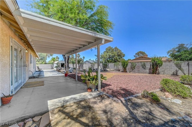 1705 Westwind Rd, Las Vegas, NV 89146 - fenced backyard with a patio area