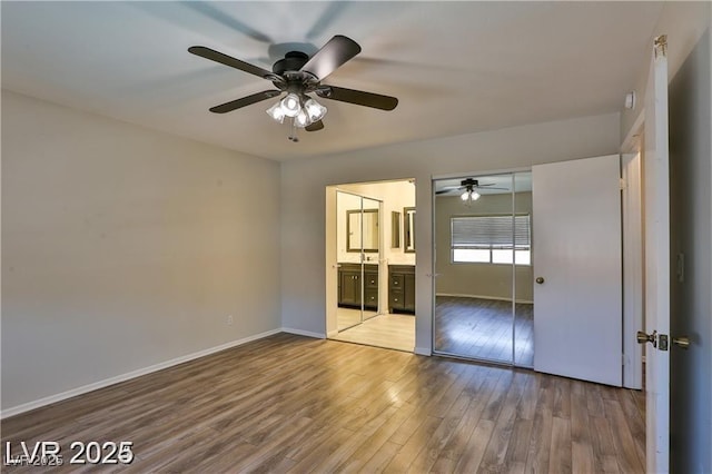 722 Barrie Ct, Henderson, NV 89002 - unfurnished bedroom with wood finished floors, ensuite bath, ceiling fan, and a closet