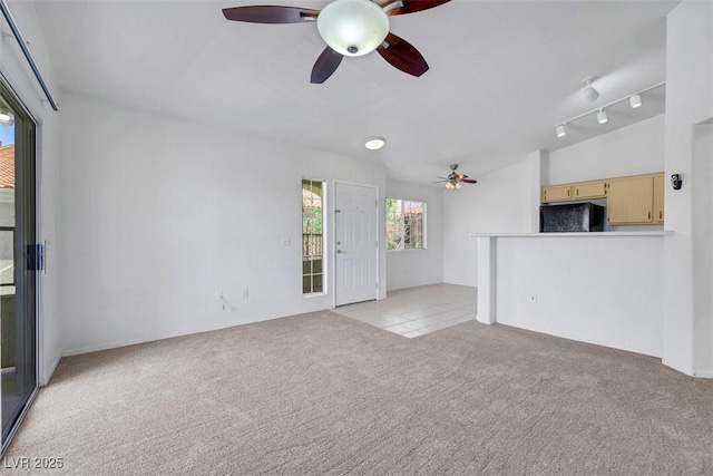1881 W Alexander Rd Unit 2093, North Las Vegas, NV 89032 - unfurnished living room with a ceiling fan, light colored carpet, and light tile patterned floors
