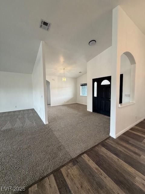 1830 Justine Ct, Pahrump, NV 89048 - entryway with dark wood-style flooring, lofted ceiling, and dark colored carpet