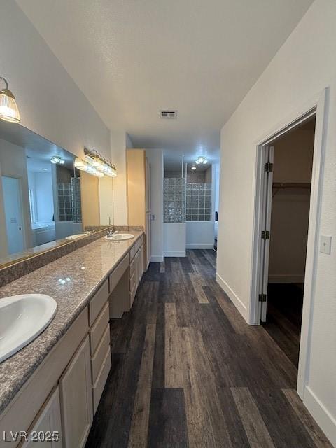 1830 Justine Ct, Pahrump, NV 89048 - full bath featuring double vanity, wood finished floors, and a walk in closet