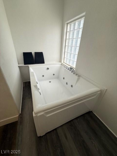 1830 Justine Ct, Pahrump, NV 89048 - full bath featuring a whirlpool tub and wood finished floors