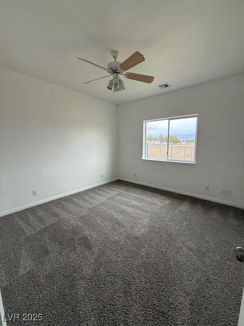 1830 Justine Ct, Pahrump, NV 89048 - spare room featuring a ceiling fan and dark carpet