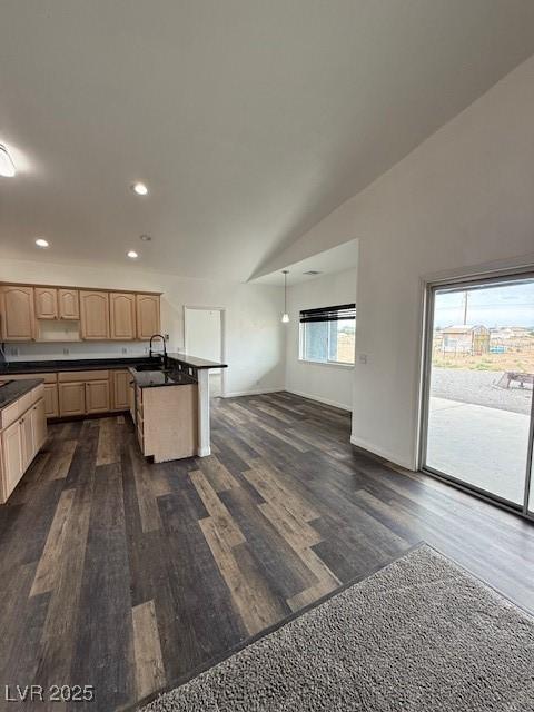 1830 Justine Ct, Pahrump, NV 89048 - kitchen featuring dark countertops, dark wood-style flooring, recessed lighting, open floor plan, and light brown cabinetry