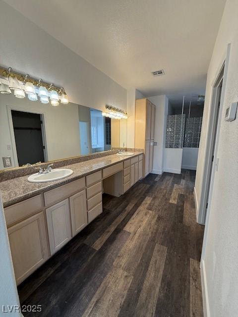 1830 Justine Ct, Pahrump, NV 89048 - bathroom featuring wood finished floors and double vanity