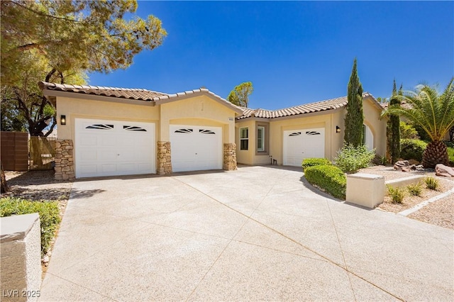 4493 Rometta Ave, Las Vegas, NV 89141 - mediterranean / spanish house with an attached garage, stucco siding, a tiled roof, driveway, and stone siding