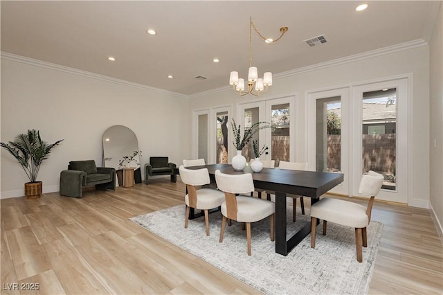 4493 Rometta Ave, Las Vegas, NV 89141 - dining room featuring a chandelier, crown molding, light wood finished floors, recessed lighting, and french doors