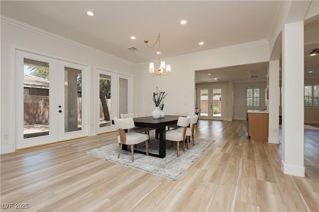 4493 Rometta Ave, Las Vegas, NV 89141 - dining room with french doors, light wood-style floors, ornamental molding, a chandelier, and recessed lighting