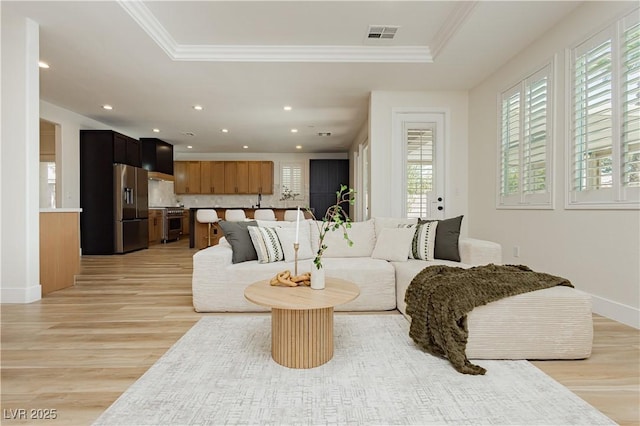 4493 Rometta Ave, Las Vegas, NV 89141 - living room with light wood-type flooring, ornamental molding, recessed lighting, and a raised ceiling