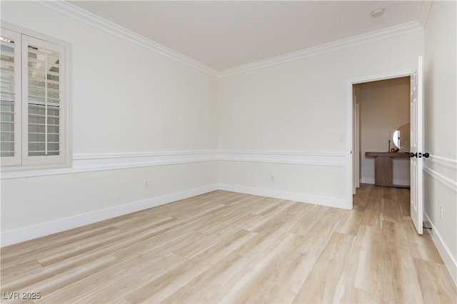 4493 Rometta Ave, Las Vegas, NV 89141 - spare room with light wood-type flooring, ornamental molding, and a smoke detector